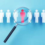Magnifying glass over symbols of people to represent searching for locums providers.