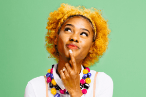 Person looking up at the sky as if in thought.