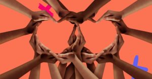 Many hands forming a heart to represent diversity in the healthcare workforce.