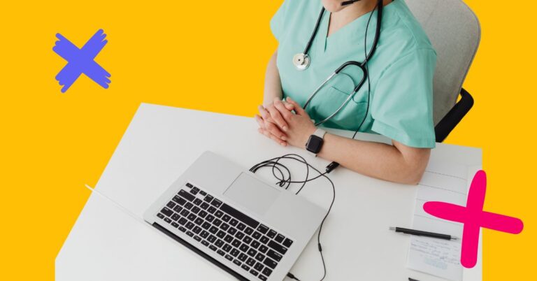 Physician in scrubs working on laptop to represent healthcare workforce trends.