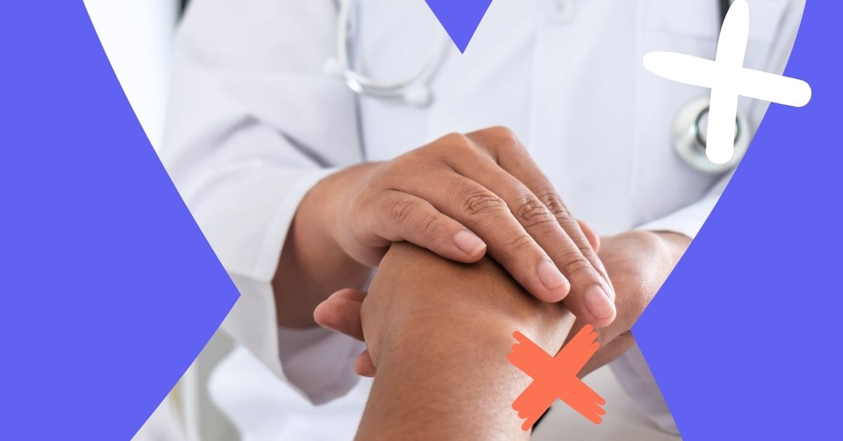 Doctor holding someone's hand to represent physician retention and job satisfaction.