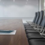 Chairs next to a table in a board room.